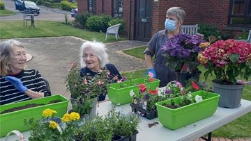 Planting flowers and tea afternoon from Hyde care home